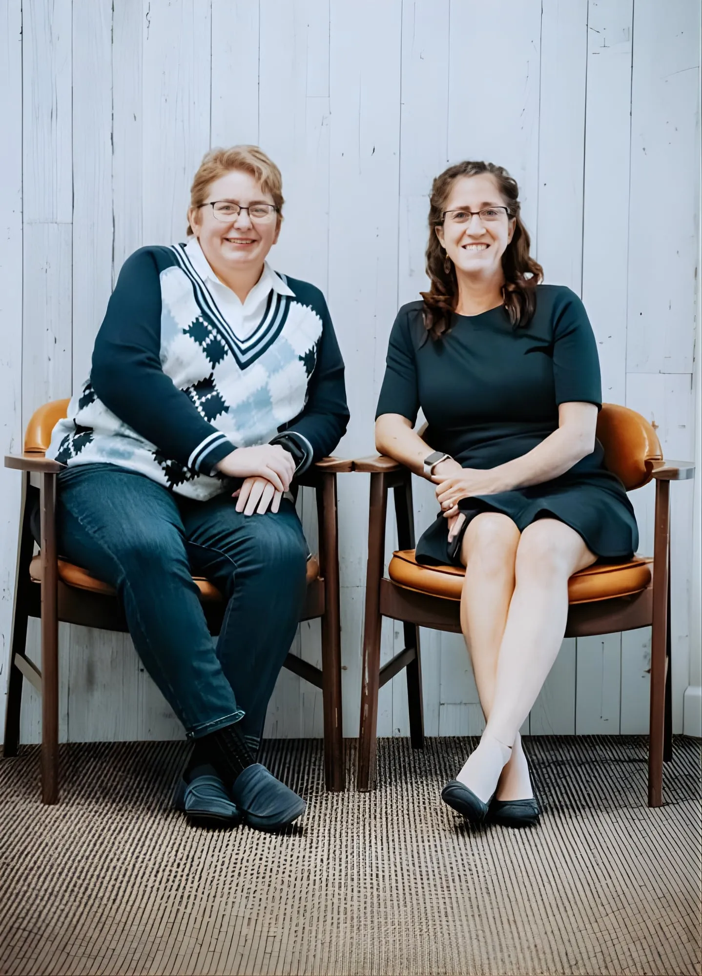 Jennifer Schenck and Rachel Morgan, the founders of Morgan and Schenck, seated together.